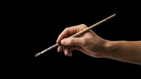Hand holding paintbrush isolated on transparent background, ready for art, design, and creative projects. Perfect for t-shirt designs, clipart, stickers, and print-on-demand products.