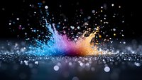 Colorful powder explosion with blue pink orange particles bursting upward against black background creating dynamic motion effect for creative projects.
