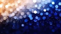 Magical bokeh lights transition from warm golden to deep blue creating dreamy abstract background with glowing particles and blurred circles effect.