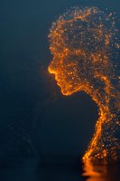Digital human head profile silhouette made of glowing orange particles dissolving into space on dark blue background for technology and AI concepts.