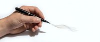 Male hand holding black pen drawing curved line on white paper surface for creative writing and artistic expression.