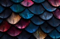 Colorful metallic fish scale pattern in blue, red, and gold tones creates dramatic texture and depth against dark background, abstract geometric design.