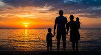 Family silhouettes watching sunset over ocean water. Parents with two children standing on beach during golden hour with dramatic sky and sun reflection on waves.