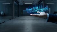 Businessman holding a glowing holographic power plant model above his hand in a modern dark office, symbolizing energy management.