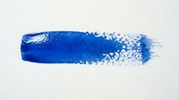 Blue paint brush stroke with textured edges and scattered droplets on white background for creative design projects.