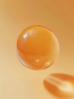 Transparent golden bubble floating against warm orange background, showcasing light reflections and delicate surface tension for cosmetic advertising.