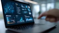 Modern laptop displaying blue data analytics dashboard with charts, graphs and network visualization on screen in corporate office environment. Business intelligence concept.
