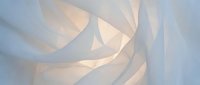 Abstract flowing ribbons in soft blue and cream tones creating elegant curved patterns with gentle lighting effects for modern design backgrounds.