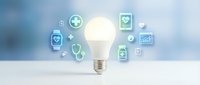 Glowing light bulb with floating healthcare medical icons on clean white surface representing innovation in telemedicine and digital health solutions.