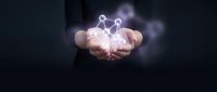 Businessman holding glowing network connection icon in cupped hands representing digital connectivity, data sharing and modern technology solutions.