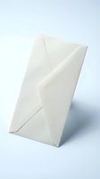 White paper envelope standing upright on light background, symbolizing mail, correspondence, and communication for business or personal use.
