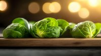 Fresh Brussels sprouts arranged on wooden cutting board with warm bokeh lights creating cozy kitchen atmosphere for healthy cooking and meal preparation.