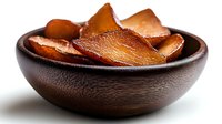 Crispy homemade coconut chips in wooden bowl, healthy vegan snack alternative to potato chips for keto and paleo diets.