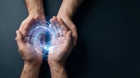 Male hands holding glowing blue energy vortex with particle effects. Concept for technology, innovation, power, and digital transformation in business and science applications.
