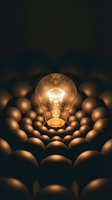 Illuminated incandescent bulb surrounded by dimmed eggs against dark background, symbolizing innovation, uniqueness, and standing out from the crowd for business concepts.