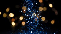 Blue glitter sparkles with golden bokeh lights creating magical festive atmosphere for holiday celebrations and luxury party decorations.