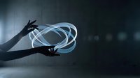 Hands holding glowing blue energy sphere with light trails in dark futuristic environment for technology and innovation concepts.