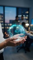 Hand holding glowing digital globe with network connections in modern office with city skyline at night, representing global business, technology, and connectivity.