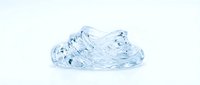 Transparent crystalline gel substance with flowing, organic texture isolated on white background, suitable for cosmetic, skincare, and design applications.