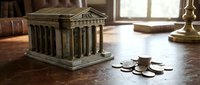 Miniature bank building model with classical columns sits on wooden desk beside scattered coins representing financial savings and investment concepts.