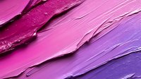 Vibrant smears of pink and purple cosmetic texture showing smooth gradient transition and creamy consistency, macro photography of makeup swatches for beauty industry.