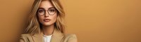 Young blonde businesswoman wearing glasses and beige blazer looking confidently at camera against brown background, modern professional portrait.