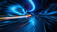 Dynamic motion blur tunnel with vibrant blue and orange light trails creating futuristic speed effect for technology and transportation concepts.