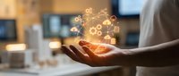 Business professional holding glowing digital innovation icons representing technology, automation, and modern workplace solutions in corporate environment.