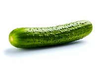 Fresh green cucumber isolated on white background, perfect for food packaging, restaurant menus, and healthy lifestyle marketing materials.