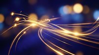 Abstract golden light trails flowing through dark blue space with bokeh effects creating dynamic energy waves for technology and motion concepts.