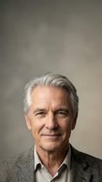 Senior man with gray hair and light complexion wearing casual blazer and open-collar shirt against neutral background. Suitable for corporate, business, healthcare, and lifestyle editorial use.