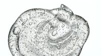 Young adult male with light skin tone, wearing clear water droplets or condensation on face and head, appearing refreshed or hydrated. Isolated on white background, suitable for wellness, skincare, hydration, and health-related design projects.