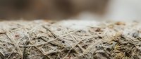Natural jute rope texture with twisted fibers in brown and beige tones for rustic crafts, nautical themes, and organic design projects.