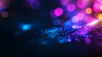 Vibrant glitter particles flowing on dark background with pink and blue bokeh lights creating magical atmosphere, suitable for abstract luxury designs and festive backgrounds.