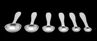 Set of six stainless steel measuring spoons in graduated sizes, isolated on transparent background, ready for kitchen, cooking, clipart, t-shirt design, and print on demand use.