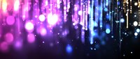Magical glowing lights with bokeh effect in pink and blue gradient colors create dreamy atmosphere with falling sparkles and light streaks background.