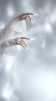 Ethereal hands reaching through translucent fabric with soft lighting creating mystical atmosphere for spiritual wellness meditation concepts.
