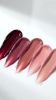 Glossy lipstick swatches in burgundy to nude pink shades on white background for beauty and cosmetics branding.