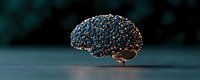 Glowing digital brain with interconnected golden light points on dark background represents artificial intelligence and neural network technology.