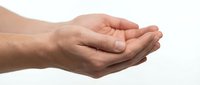 Cupped hands gesture showing protection, care and support concept isolated on white background for healthcare, charity and assistance designs.