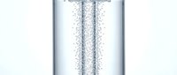 Effervescent bubbles rising through clear liquid in glass container, carbonated beverage or sparkling water concept for refreshment and hydration designs.