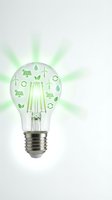 Light bulb with green eco symbols radiating energy beams representing renewable power and sustainable technology solutions for environmental innovation.