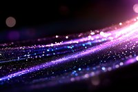 Abstract purple and pink glittering light streaks with bokeh effects on dark background for digital design and technology concepts.