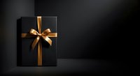 Elegant black gift box with golden ribbon bow on dark background, suitable for luxury product packaging and holiday promotional designs.