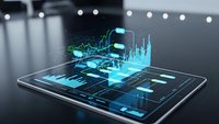 Digital tablet displaying holographic financial data visualization with glowing blue charts and graphs for business analytics and technology presentations.