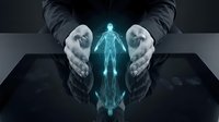 Business hands protecting glowing digital human hologram on dark surface representing healthcare insurance coverage and employee protection concepts.