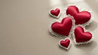 Red heart-shaped cookies with white icing borders on beige background for Valentine's Day celebration, romance, love themed baking and dessert designs.
