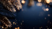 Golden pine branches with warm bokeh lights on dark blue background for holiday greeting cards and festive decorations.