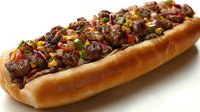 Grilled steak sandwich loaded with tender meat pieces, colorful bell peppers, onions and corn on fresh toasted baguette, served on white background for menu design.