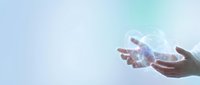Hands releasing white dove into bright sky symbolizing peace, freedom, hope and spiritual liberation with soft light rays.